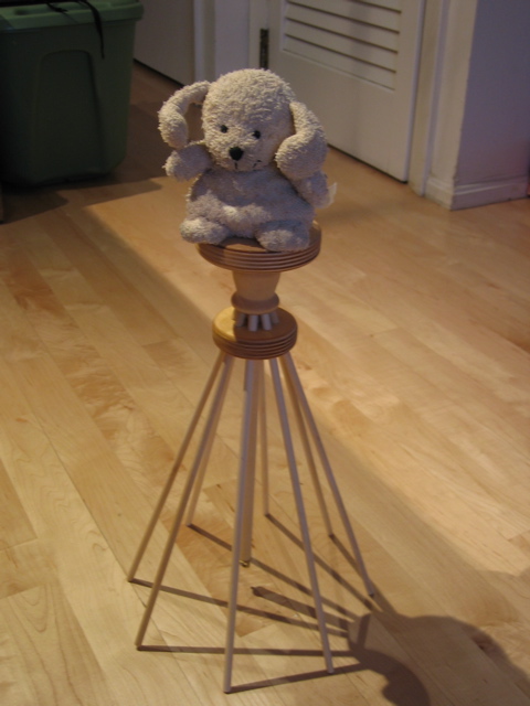 Mickey on top of wooden stool
